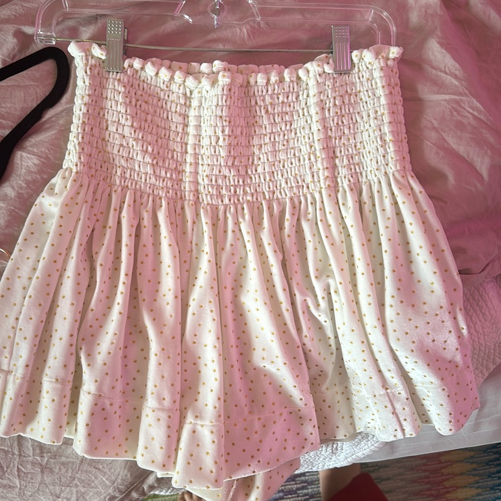 White velvet shop Koch skirt with gold polka dots.